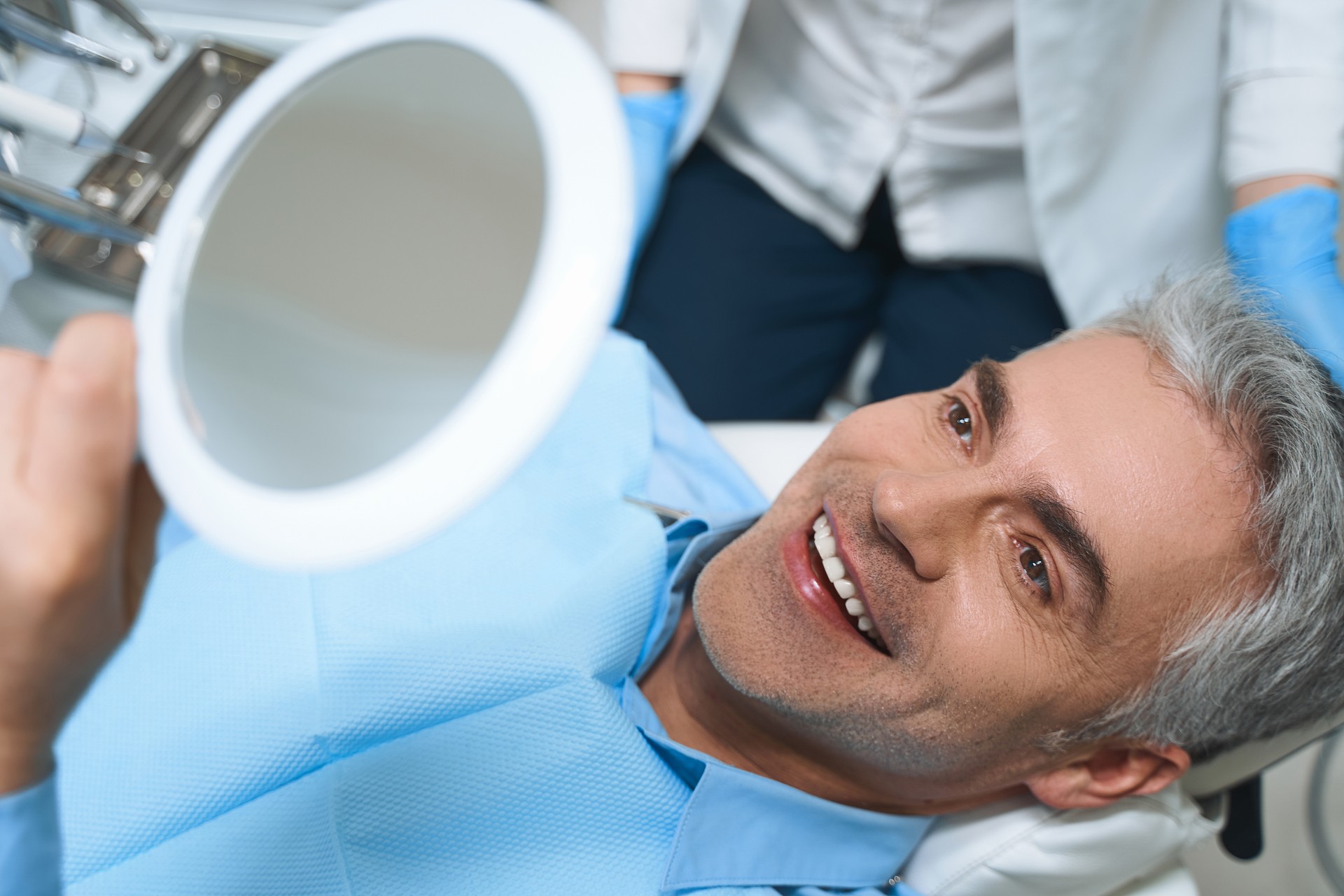 Happy man after dental procedures stock photo